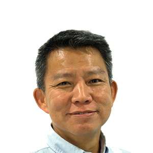 Headshot of a smiling East Asian man with short dark hair wearing a light blue collared shirt.