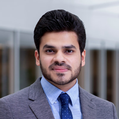 Professional man in suit and tie smiling at camera