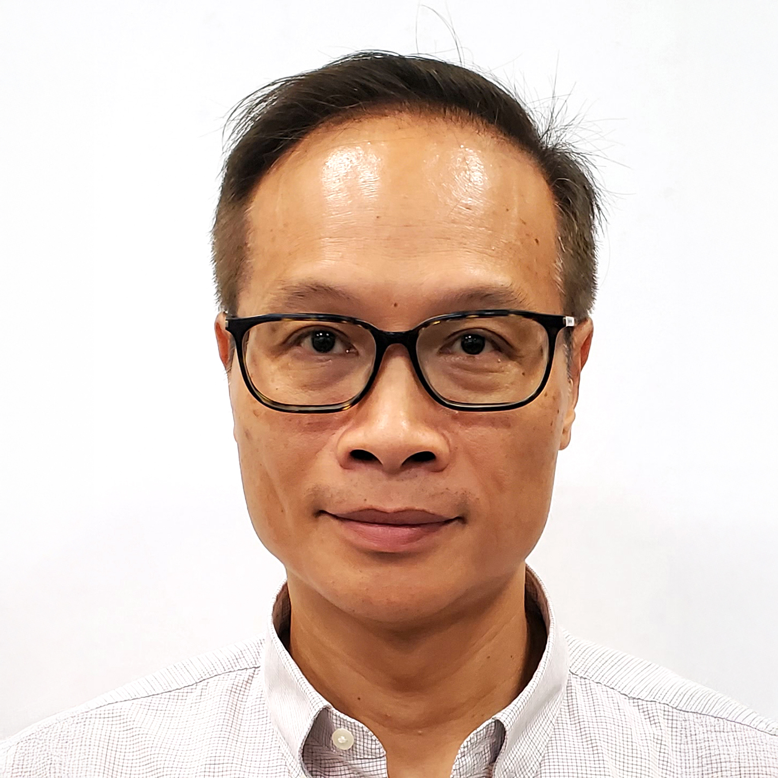 Headshot of a man with glasses wearing a collared shirt