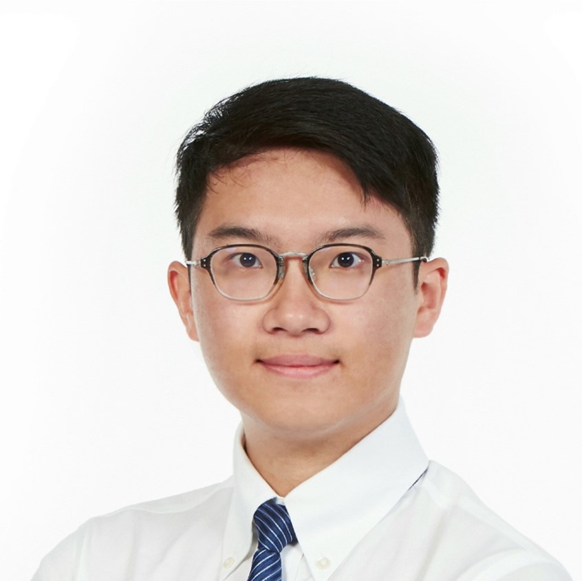Portrait of a man with glasses wearing a white shirt and blue striped tie.