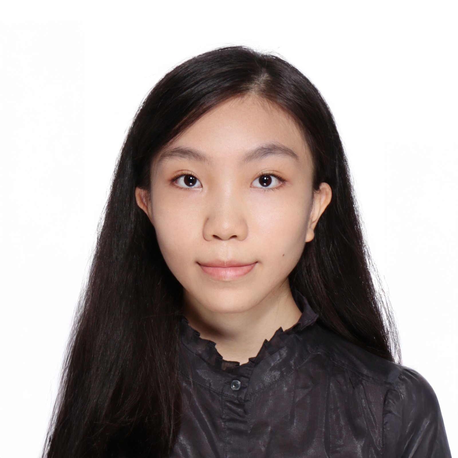 Portrait of a young woman with long dark hair wearing a dark collared shirt.
