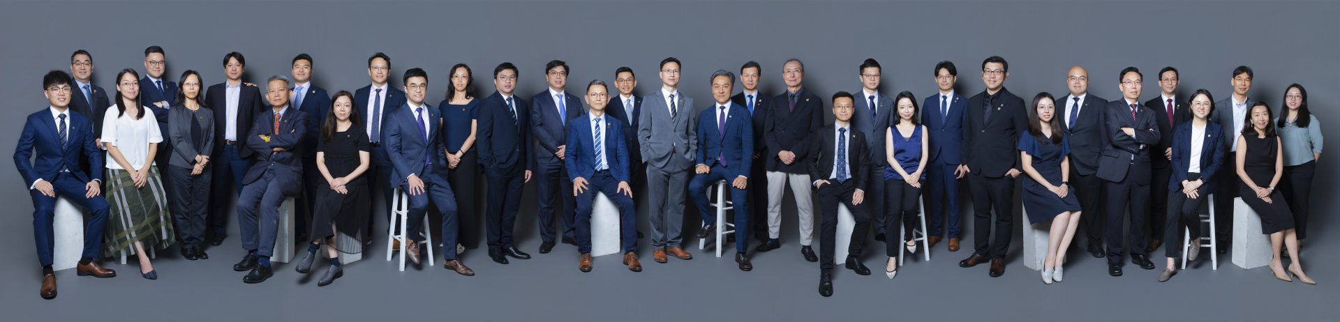 Group photo of GE Committee members for 2025-2026 term, posing formally in business attire.