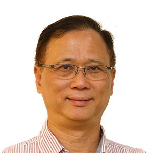 Portrait of a smiling man with glasses wearing a striped shirt
