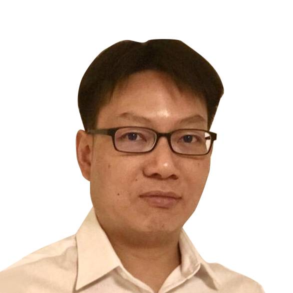 Headshot of a man with glasses wearing a light-colored collared shirt.
