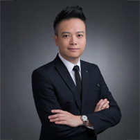 Professional headshot of Chris Kwan Ho Sum in suit with arms crossed