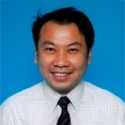 Portrait of deputy chairman for 2024-2025, smiling in business attire against blue background