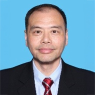 Portrait of Otto Mak Wai Hung in suit and tie against blue background