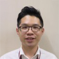 Portrait of Henry Ngai wearing glasses and a collared shirt.