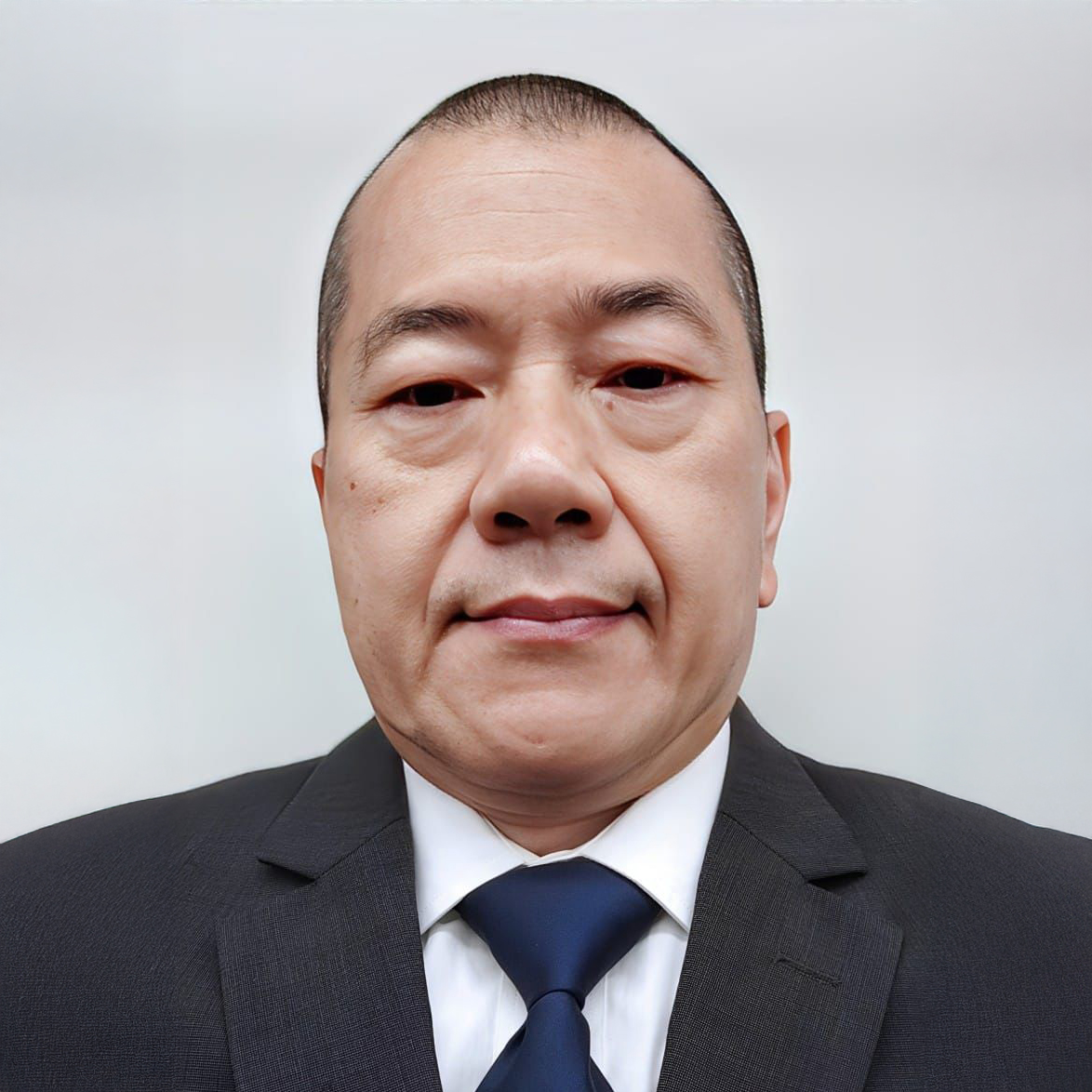 Portrait of Dr YC Chau in suit and tie