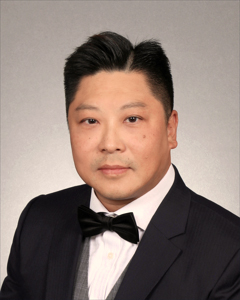 Man in suit and bow tie, formal portrait