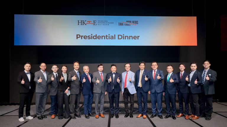 Group of professionals posing with thumbs up at HKIE Presidential Dinner event.