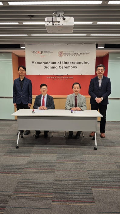 Men signing agreement
