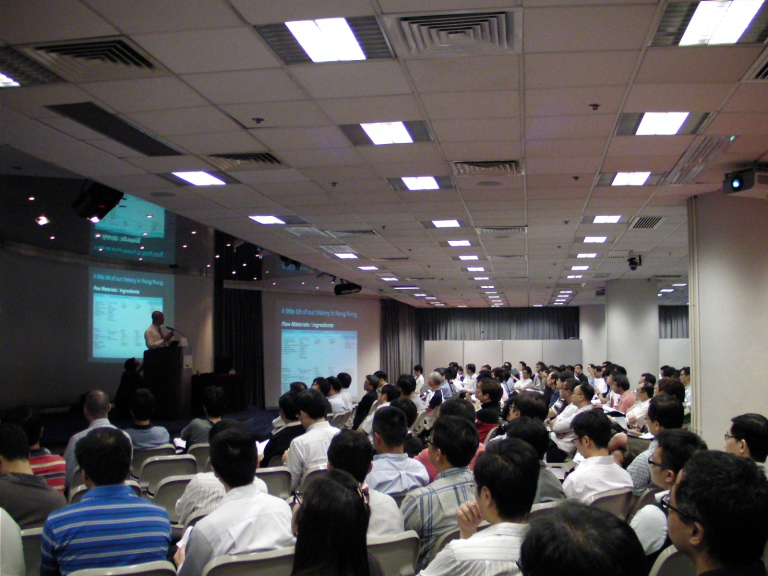 Audience attending presentation on raw materials in Hong Kong