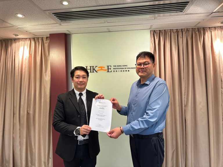 Two men presenting a certificate at The Hong Kong Institution of Engineers.