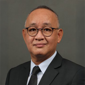 Portrait of a man with glasses wearing a suit and tie
