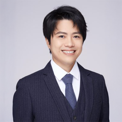 Professional headshot of a smiling man in a suit and tie
