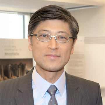 Man in suit and glasses at an event