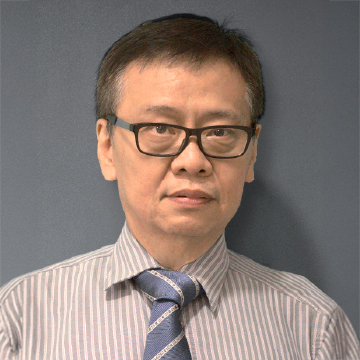 Man with glasses and striped shirt wearing a patterned tie