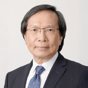 Professional headshot of a man in suit and glasses