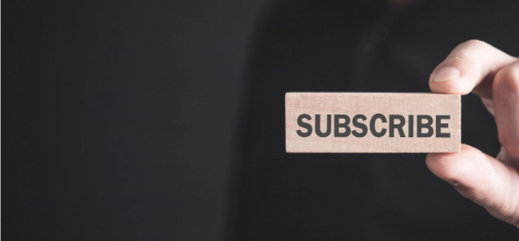 Hand holding block with subscribe
