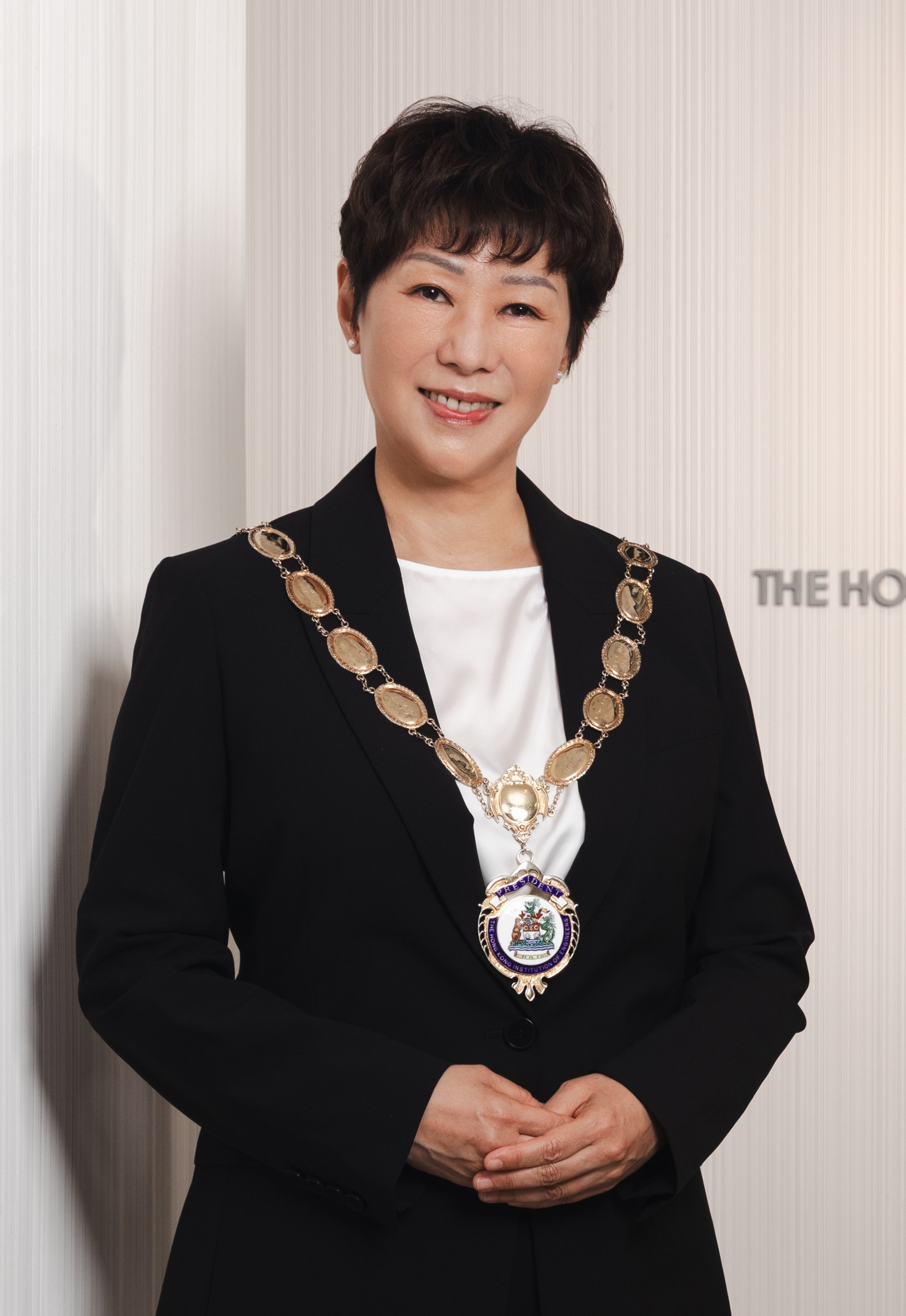 Woman wearing presidential chain of office for The Hong Kong Institution of Engineers.