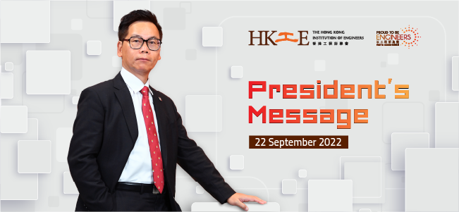 "Man in suit and glasses gestures toward ""President's Message"" dated 22 September 2022."