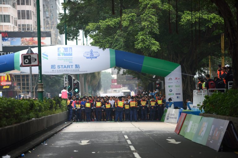 Runners and officials at the start line of the 15th Asian Marathon Championships in Hong Kong.