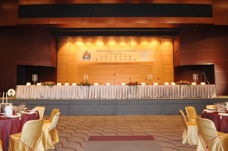 Stage setup for The Hong Kong Institution of Engineers 35th Annual Dinner with decorated tables and floral arrangements.