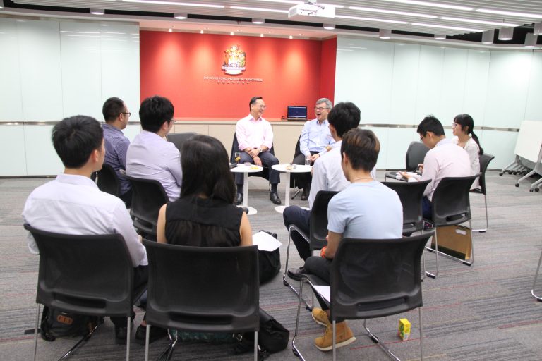 Group of professionals seated in a circle during a meeting at The Hong Kong Institution of Engineers.