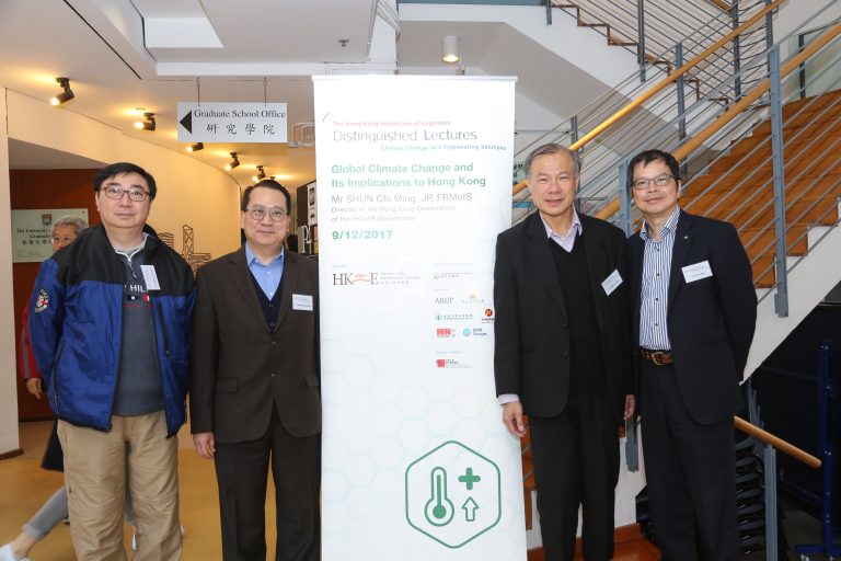 Men smiling near board