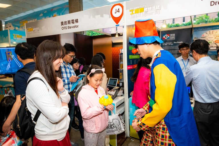 Clown interacts with attendees at The HKIE Engineer Day event booth.