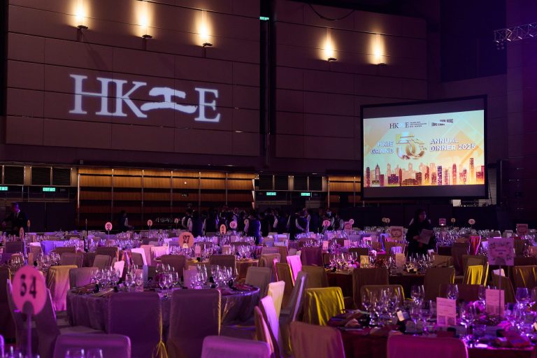 HKIE 50th Annual Dinner 2025 venue with set tables and large projection screens.