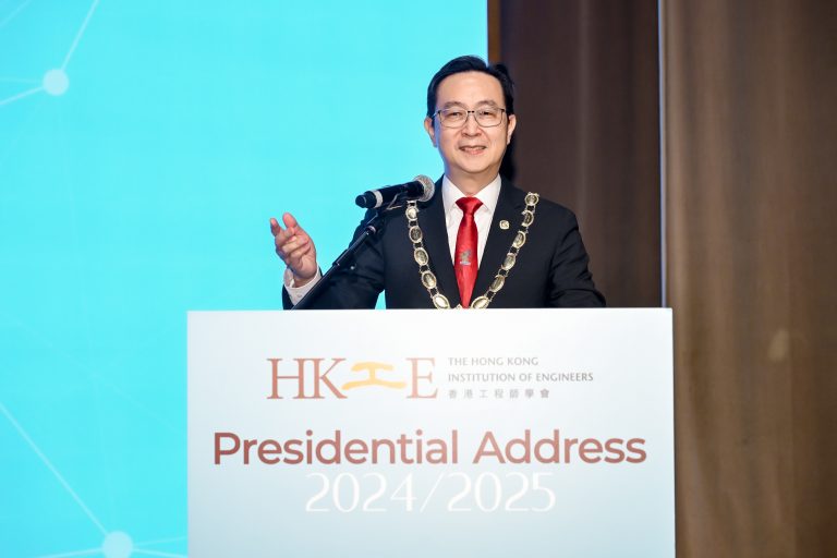 Man in formal attire and ceremonial chain delivering presidential address at Hong Kong Institution of Engineers event.