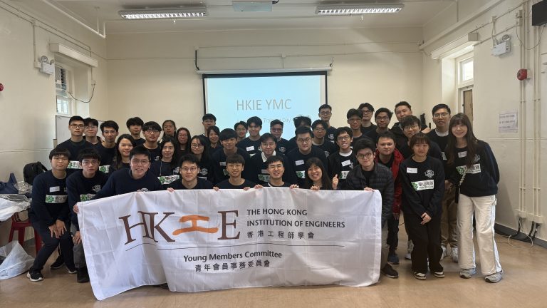 Group of young engineers posing with HKIE Young Members Committee banner at training day