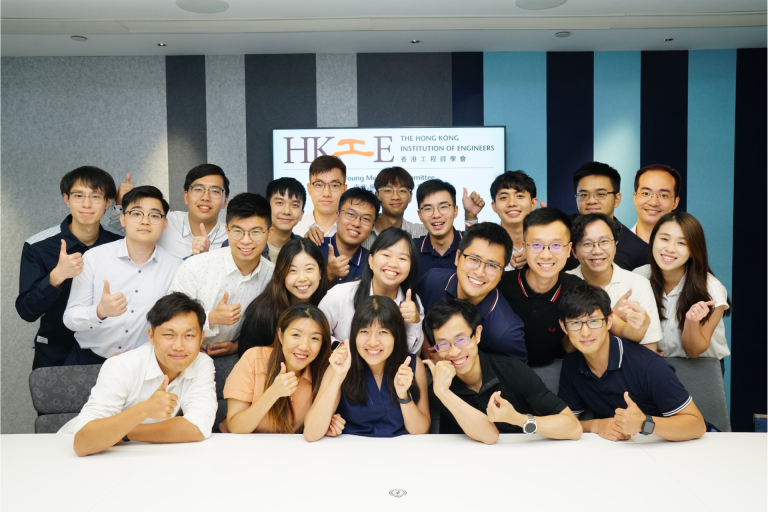 Group of young engineers posing with thumbs up at HKIE Young Members Committee event.